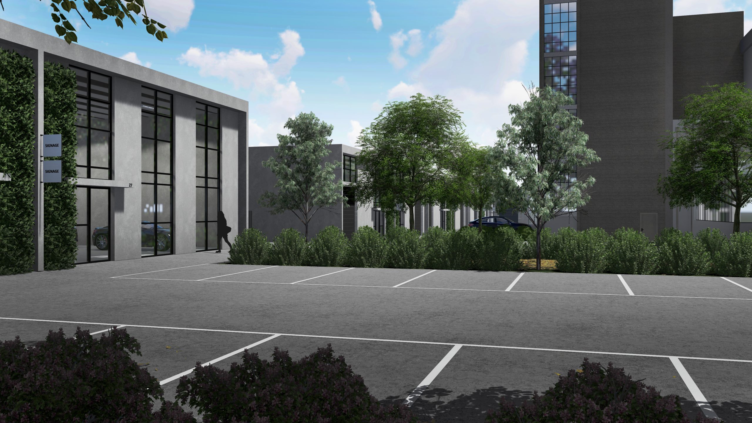 Modern industrial warehouse units for lease at Geelong Power Station redevelopment, large carpark, green trees surrounding the area and a large building in the background, concept by Hamilton Group